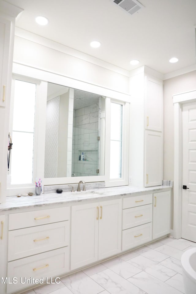 bathroom with visible vents, recessed lighting, a shower stall, marble finish floor, and a wealth of natural light