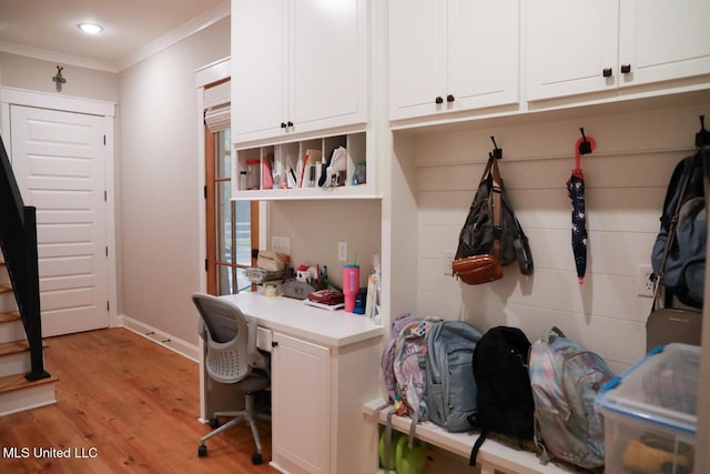 office with recessed lighting, light wood-style floors, baseboards, and ornamental molding