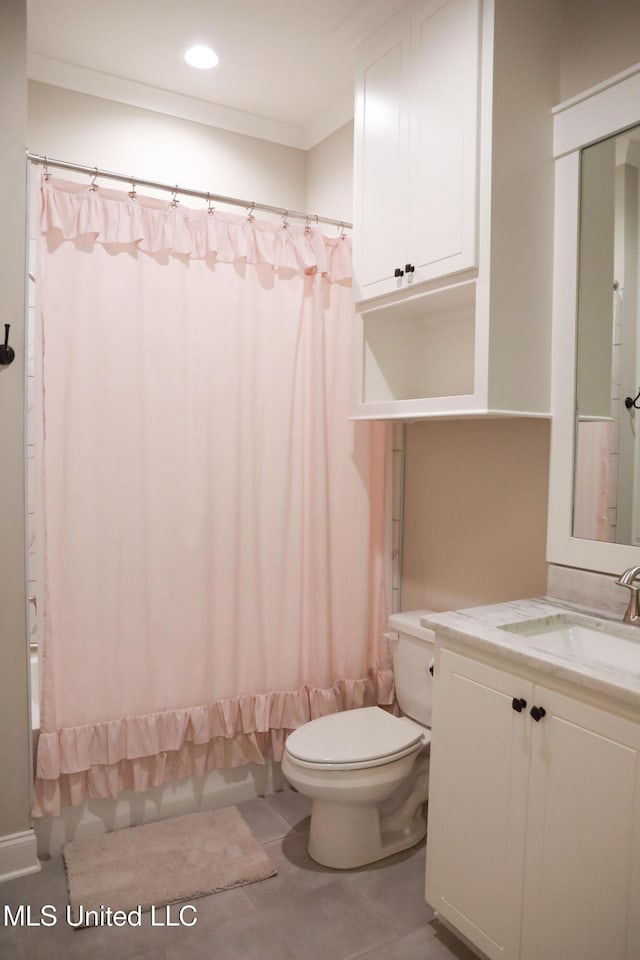 bathroom featuring vanity, ornamental molding, tile patterned flooring, shower / bath combo with shower curtain, and toilet