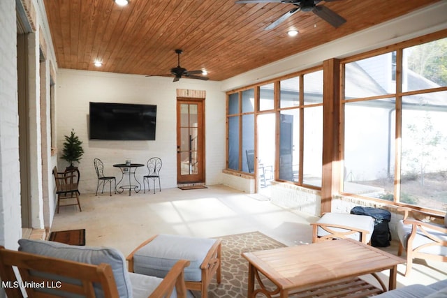 sunroom with wood ceiling and ceiling fan