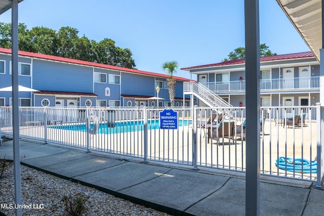 view of swimming pool with a patio area