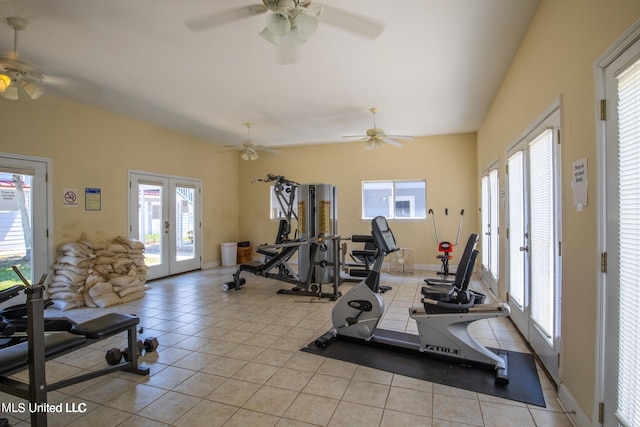 workout room featuring french doors and light tile patterned flooring