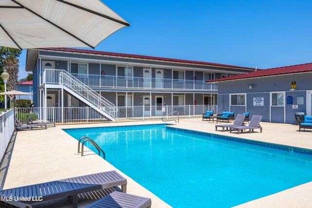 view of pool featuring a patio area