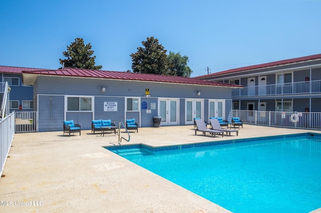 view of swimming pool featuring a patio