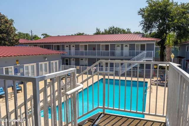 view of swimming pool featuring a patio