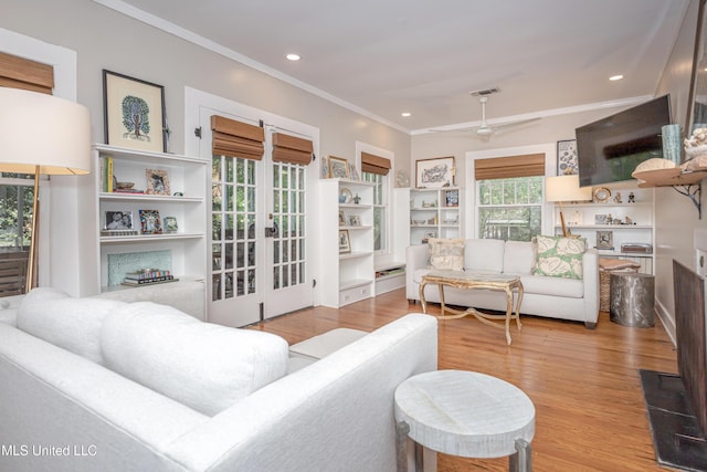 319 Washington Ave, Ocean Springs, MS 39564 - living room featuring ornamental molding, wood finished floors, and recessed lighting
