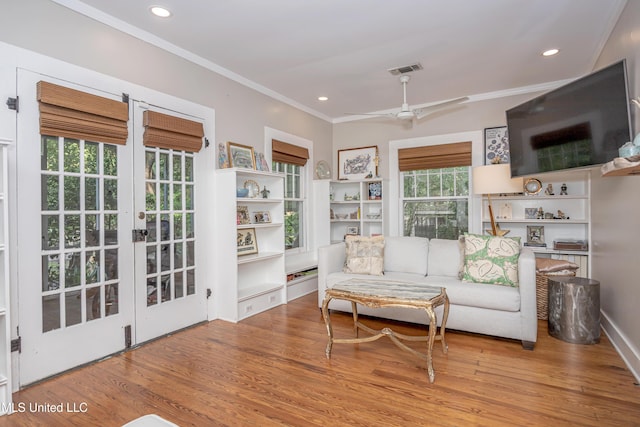 319 Washington Ave, Ocean Springs, MS 39564 - living room with crown molding, wood finished floors, ceiling fan, french doors, and recessed lighting