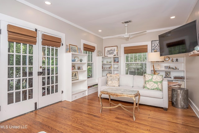 319 Washington Ave, Ocean Springs, MS 39564 - living area featuring ornamental molding, wood finished floors, french doors, a ceiling fan, and recessed lighting