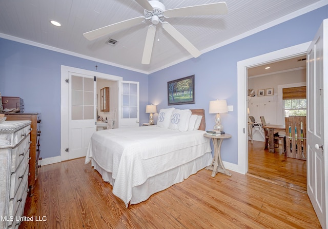 319 Washington Ave, Ocean Springs, MS 39564 - bedroom with light wood-style flooring, crown molding, recessed lighting, baseboards, and a ceiling fan