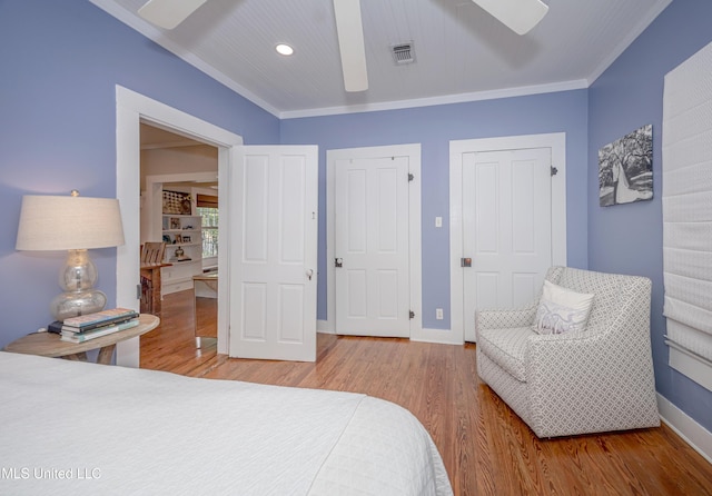 319 Washington Ave, Ocean Springs, MS 39564 - bedroom with wood finished floors, baseboards, recessed lighting, crown molding, and ceiling fan