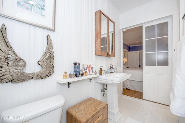 319 Washington Ave, Ocean Springs, MS 39564 - bathroom featuring toilet and wood finished floors
