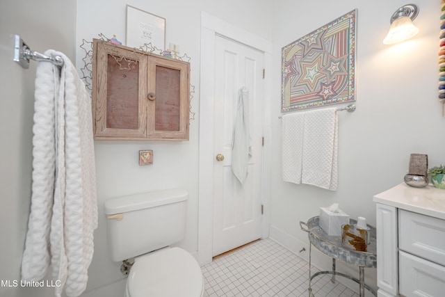 319 Washington Ave, Ocean Springs, MS 39564 - bathroom with toilet, tile patterned floors, and vanity
