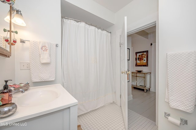319 Washington Ave, Ocean Springs, MS 39564 - bathroom featuring vanity, tile patterned floors, and a shower with shower curtain