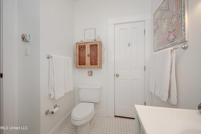 319 Washington Ave, Ocean Springs, MS 39564 - bathroom featuring toilet, baseboards, vanity, and tile patterned flooring
