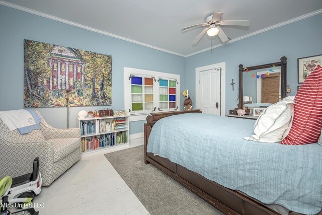 319 Washington Ave, Ocean Springs, MS 39564 - bedroom with crown molding and a ceiling fan