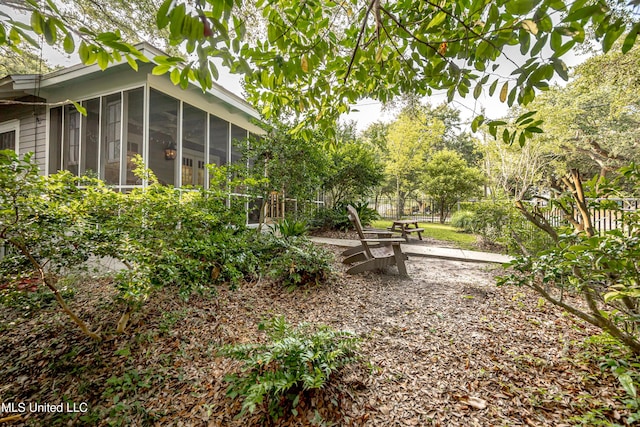 319 Washington Ave, Ocean Springs, MS 39564 - view of yard with a sunroom