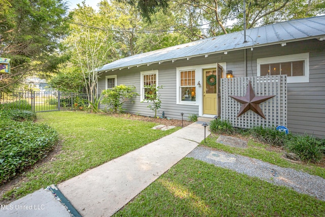 319 Washington Ave, Ocean Springs, MS 39564 - view of front facade featuring metal roof