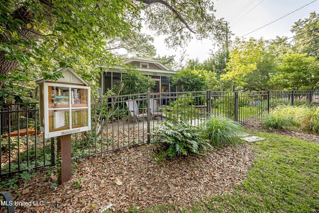 319 Washington Ave, Ocean Springs, MS 39564 - view of yard with a sunroom