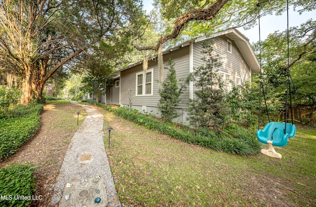 319 Washington Ave, Ocean Springs, MS 39564 - view of property exterior with a playground and a lawn