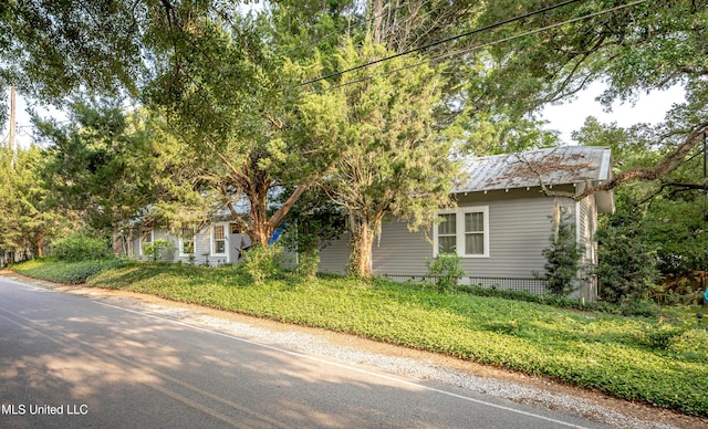 319 Washington Ave, Ocean Springs, MS 39564 - obstructed view of property featuring a front lawn