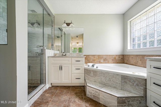 119 Vance Cv, Byhalia, MS 38611 - full bathroom featuring vanity, a shower stall, and a bath