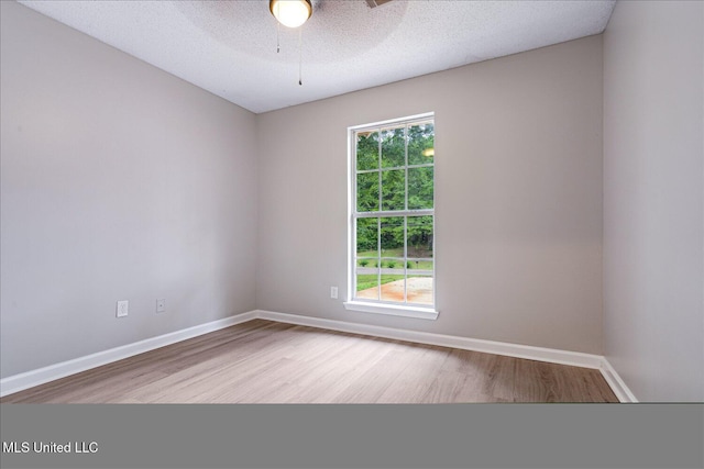 119 Vance Cv, Byhalia, MS 38611 - empty room featuring wood finished floors, a ceiling fan, baseboards, and a textured ceiling