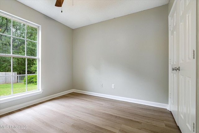 119 Vance Cv, Byhalia, MS 38611 - spare room with wood finished floors, baseboards, and a ceiling fan