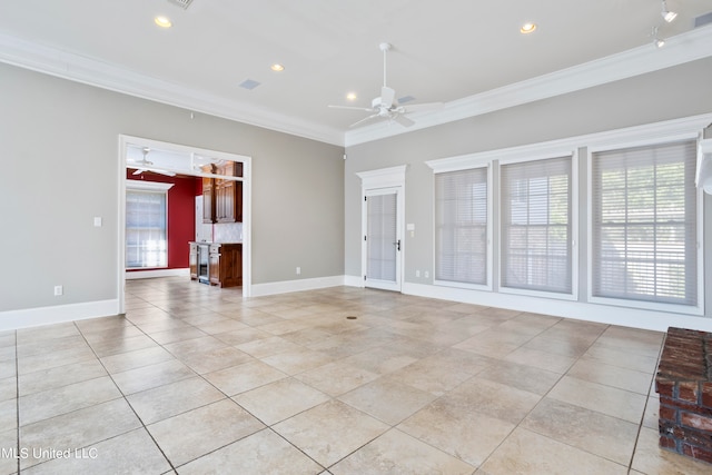 tiled empty room featuring crown molding and ceiling fan