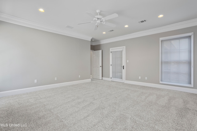 empty room with crown molding, carpet flooring, and ceiling fan