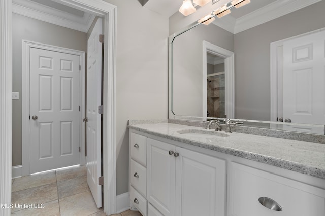 bathroom with vanity, crown molding, a shower, and tile patterned flooring