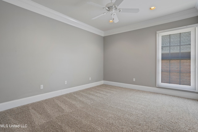 carpeted spare room featuring ornamental molding and ceiling fan