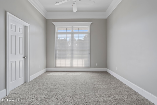 unfurnished room with crown molding, carpet, and ceiling fan