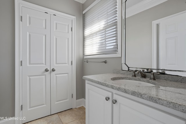 bathroom featuring vanity, crown molding, and tile patterned floors