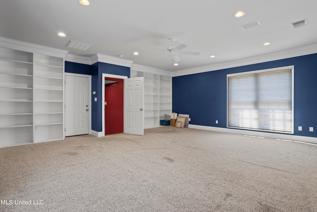 unfurnished bedroom featuring carpet, crown molding, and ceiling fan