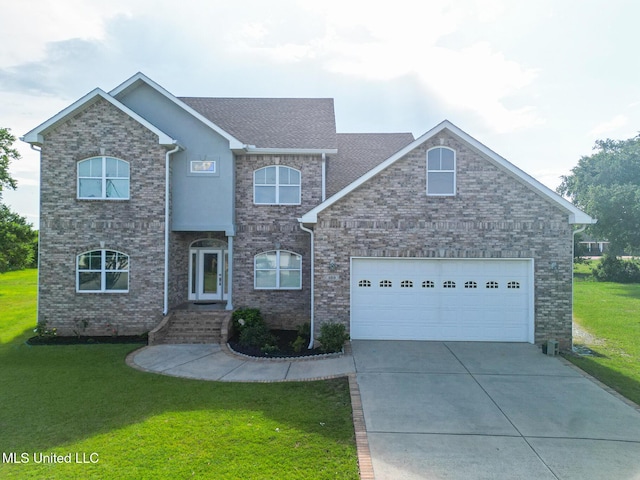 103 Buena Vista Dr, Long Beach, MS 39560 - view of front of home featuring driveway, a front lawn, a garage, and a shingled roof