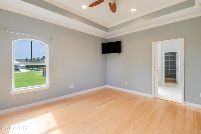 103 Buena Vista Dr, Long Beach, MS 39560 - unfurnished room with a ceiling fan, light wood-style floors, recessed lighting, ornamental molding, and a tray ceiling