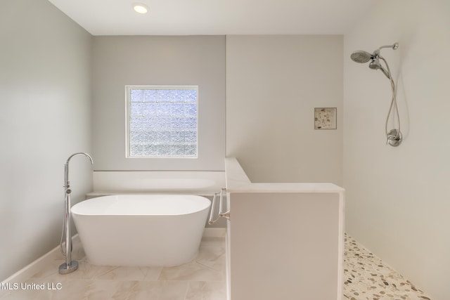 103 Buena Vista Dr, Long Beach, MS 39560 - bathroom featuring a soaking tub, a shower, and recessed lighting