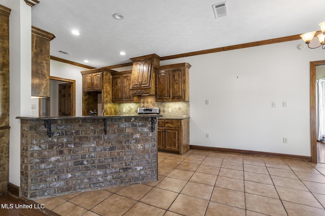 221 Penny Ln, Brandon, MS 39042 - kitchen with ornamental molding, light tile patterned flooring, decorative backsplash, recessed lighting, and baseboards