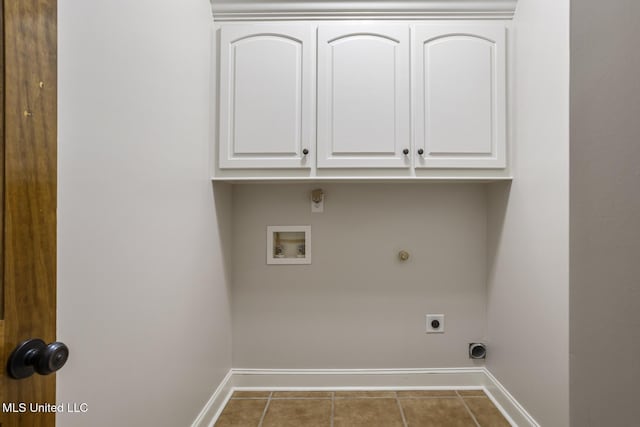 221 Penny Ln, Brandon, MS 39042 - washroom with electric dryer hookup, baseboards, washer hookup, tile patterned flooring, and cabinet space