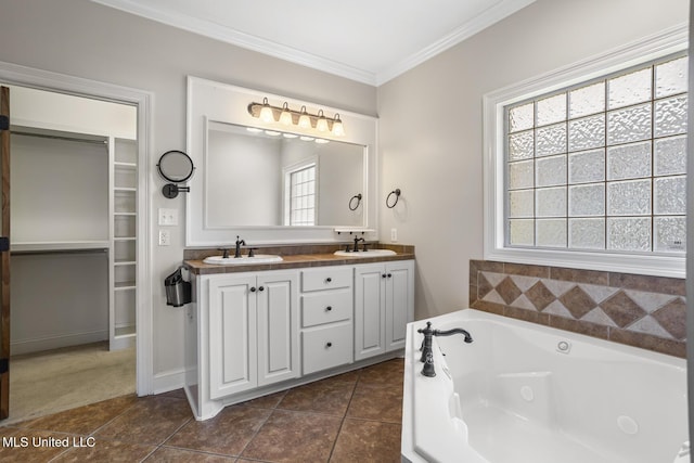 221 Penny Ln, Brandon, MS 39042 - bathroom with ornamental molding, healthy amount of natural light, double vanity, a jetted tub, and tile patterned floors