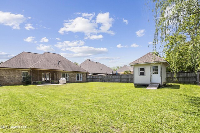 221 Penny Ln, Brandon, MS 39042 - view of yard with an outdoor structure and a patio
