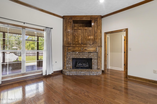 221 Penny Ln, Brandon, MS 39042 - unfurnished living room featuring ornamental molding, baseboards, wood finished floors, and a fireplace