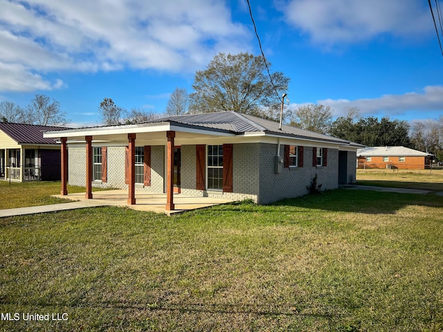 exterior space featuring a front lawn and a porch