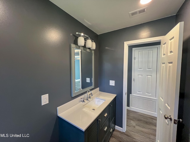 bathroom featuring vanity and hardwood / wood-style flooring