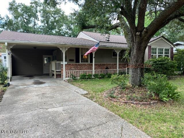 single story home featuring a carport and a porch