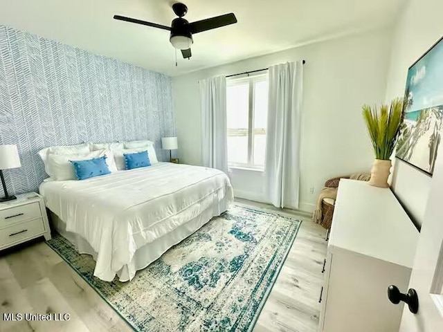 bedroom featuring ceiling fan and light wood-type flooring