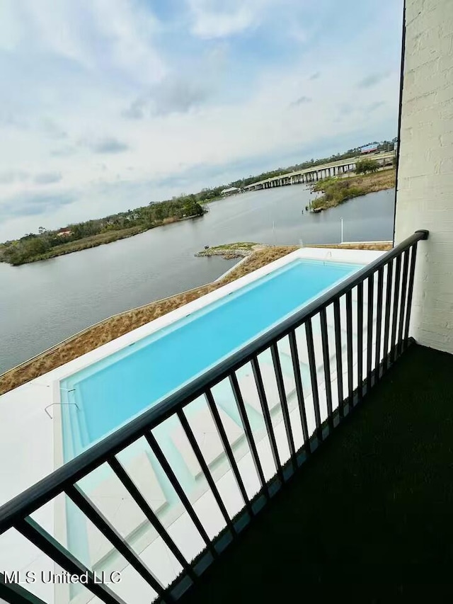 balcony featuring a water view