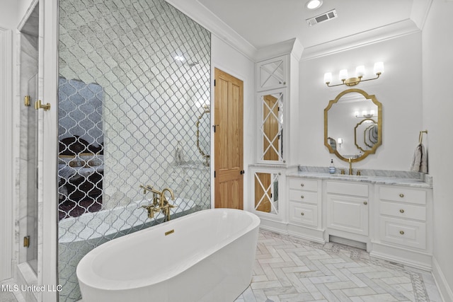 bathroom featuring ornamental molding, a bathing tub, parquet floors, and vanity