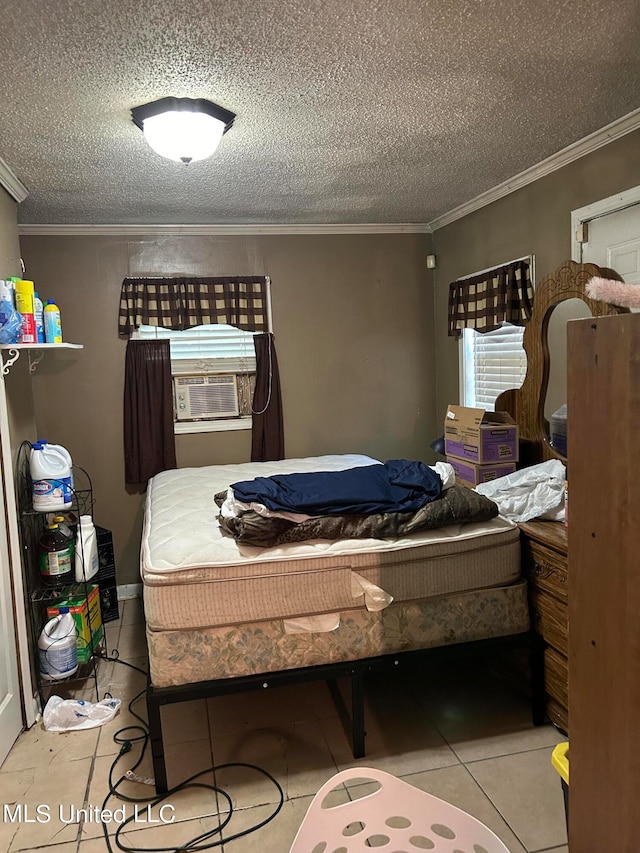 bedroom with crown molding, a textured ceiling, cooling unit, and light tile patterned floors