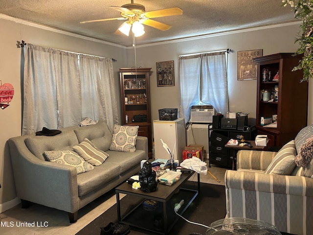 living room with crown molding, a textured ceiling, and ceiling fan